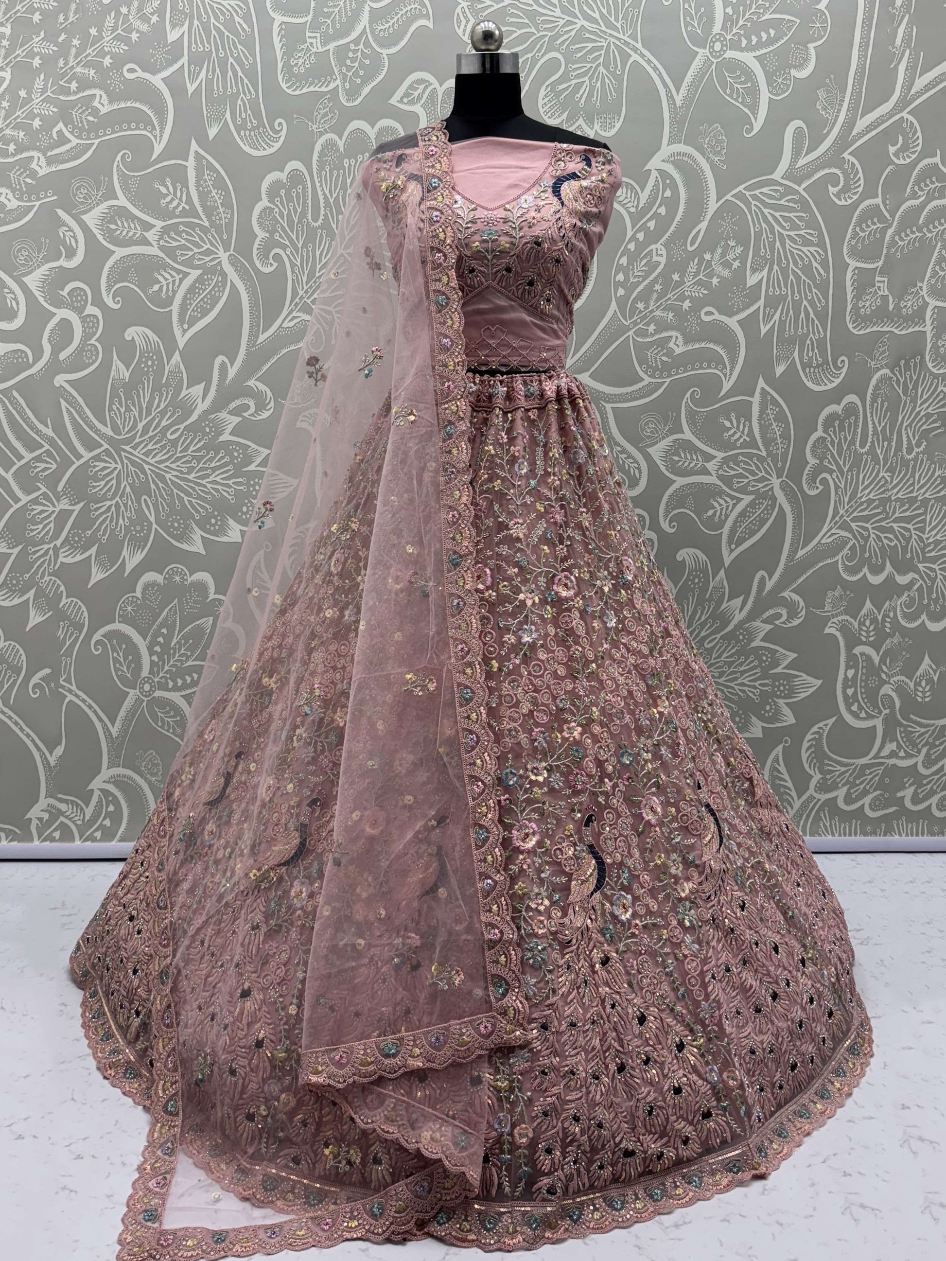 Magnetic Peach Net Sequins Wedding Wear Lehenga Choli With Dupatta