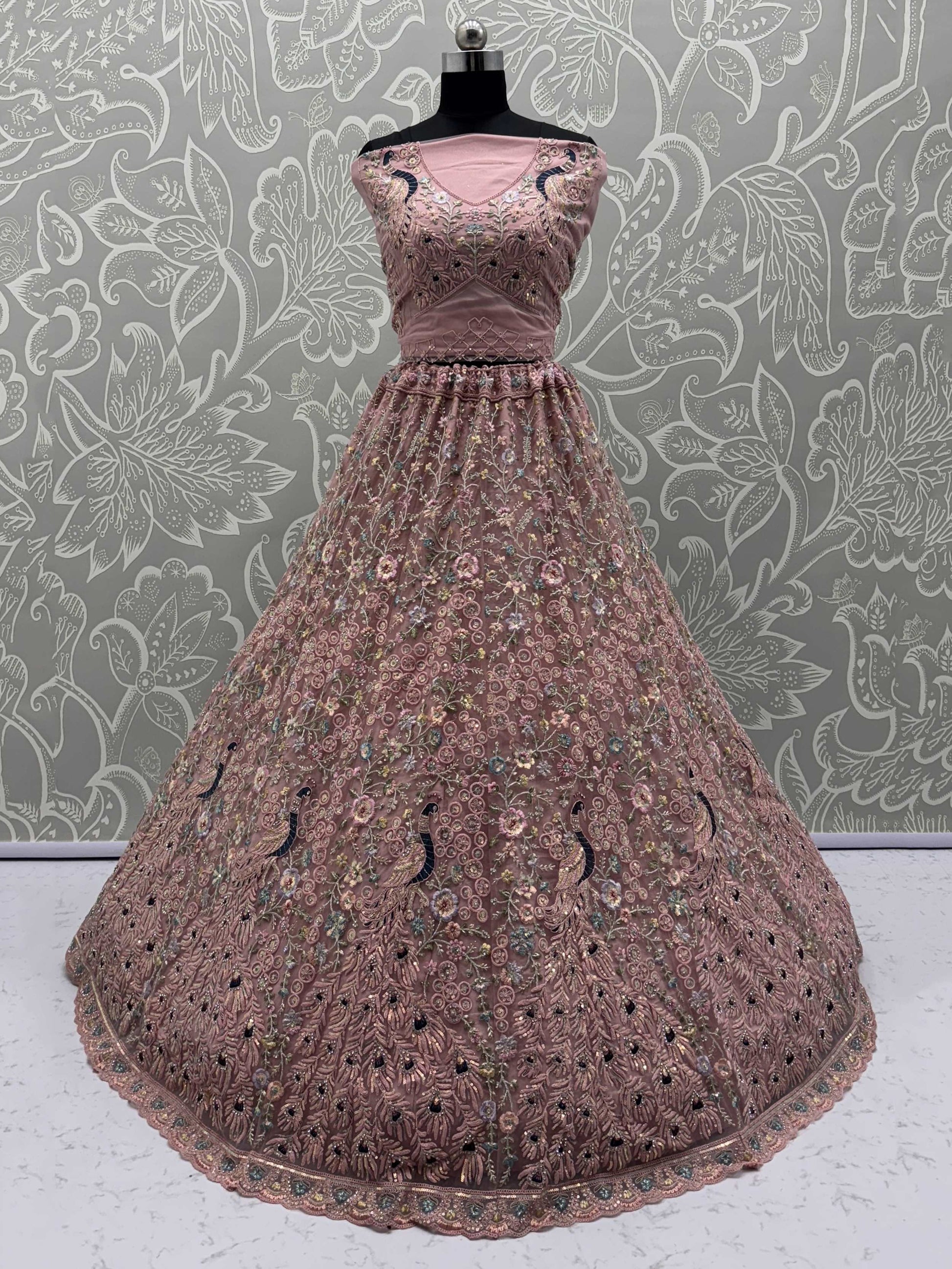 Magnetic Peach Net Sequins Wedding Wear Lehenga Choli With Dupatta