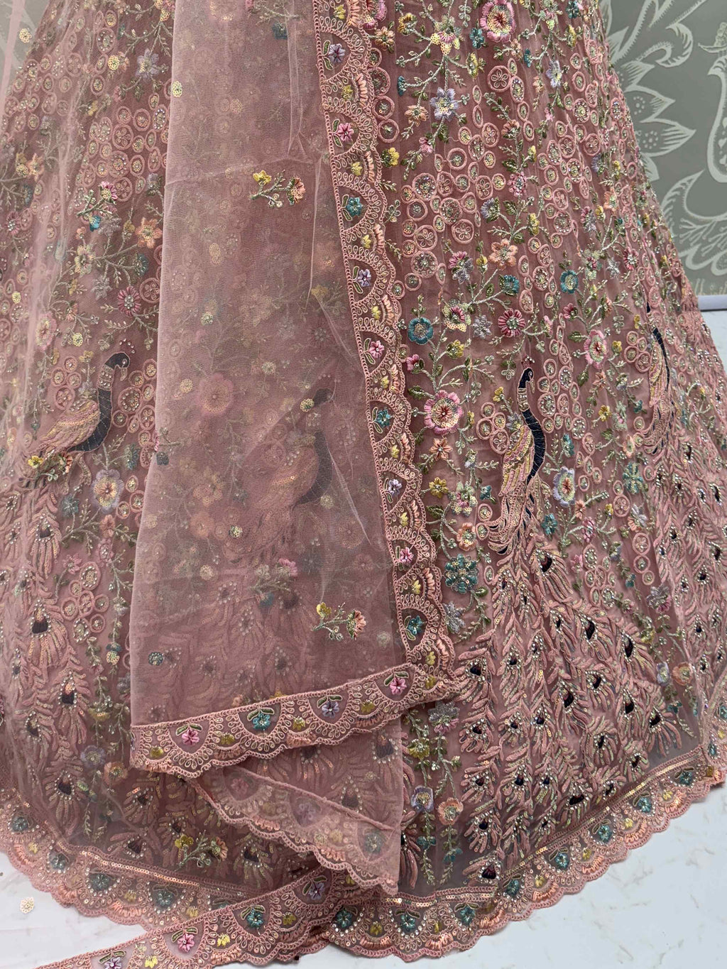 Magnetic Peach Net Sequins Wedding Wear Lehenga Choli With Dupatta