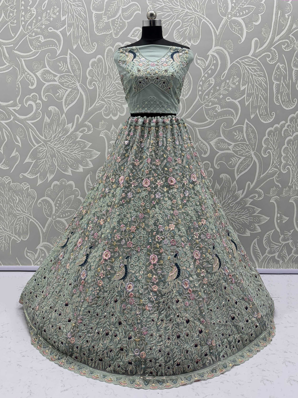 Dazzling Sky Blue Net Zari Embroidered Reception Wear Lehenga Choli