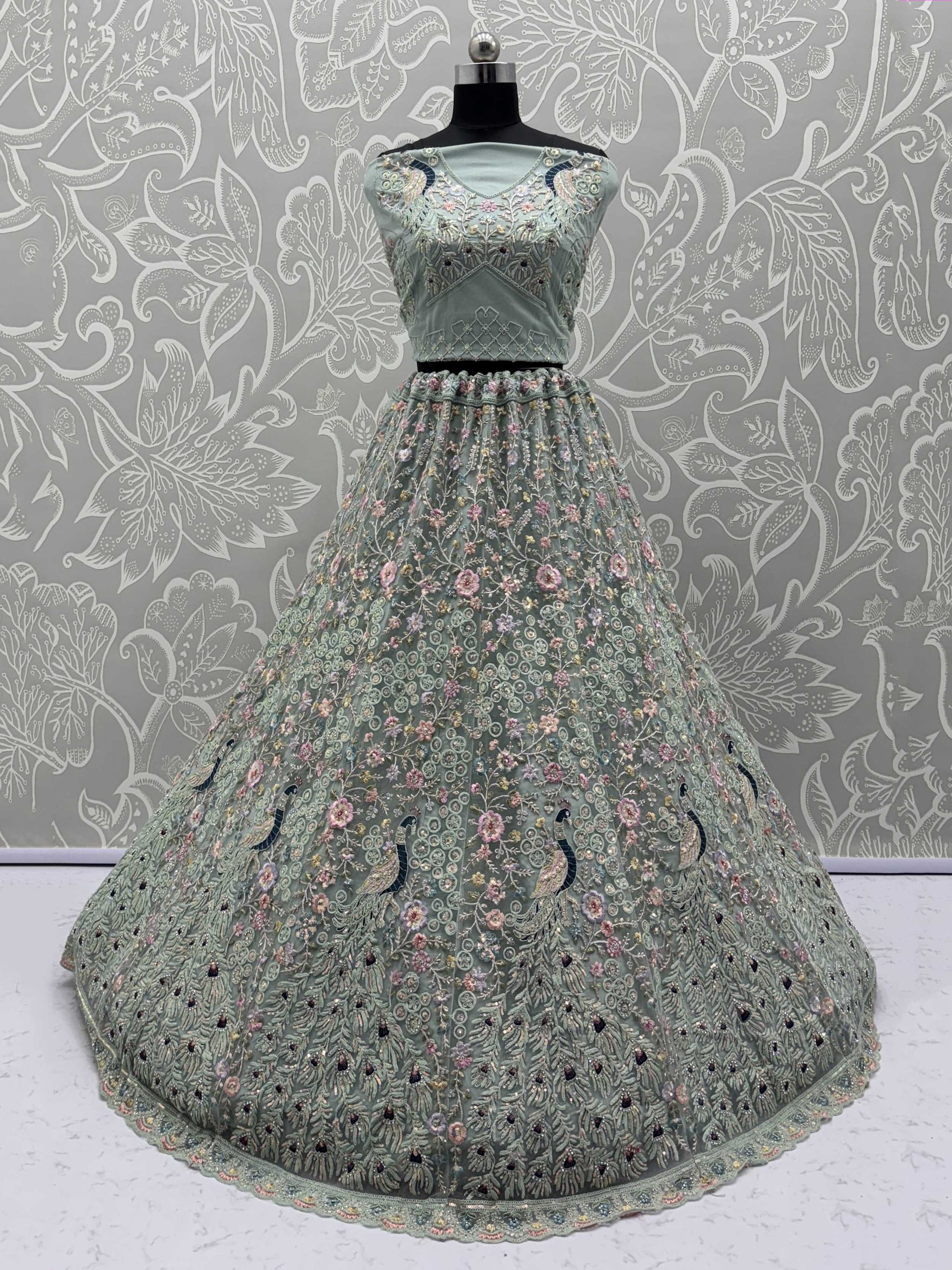 Dazzling Sky Blue Net Zari Embroidered Reception Wear Lehenga Choli