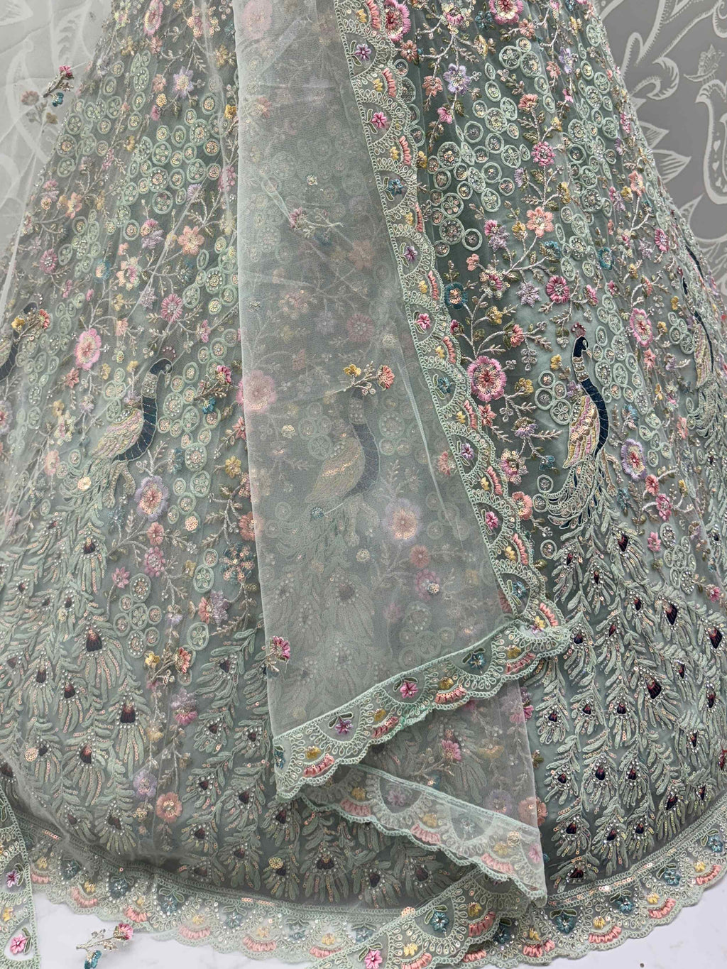 Dazzling Sky Blue Net Zari Embroidered Reception Wear Lehenga Choli