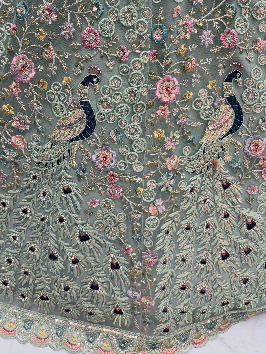 Dazzling Sky Blue Net Zari Embroidered Reception Wear Lehenga Choli