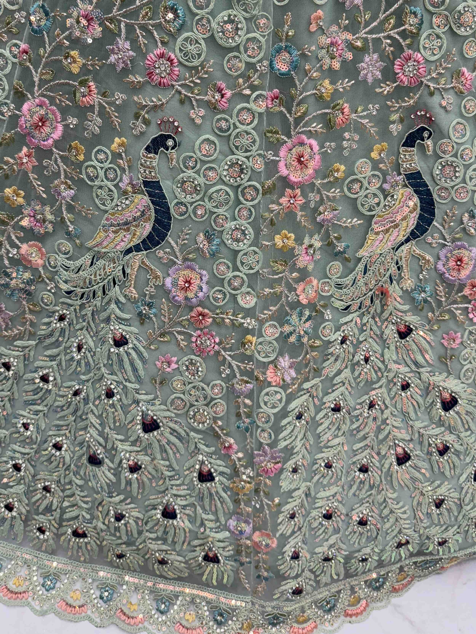 Dazzling Sky Blue Net Zari Embroidered Reception Wear Lehenga Choli