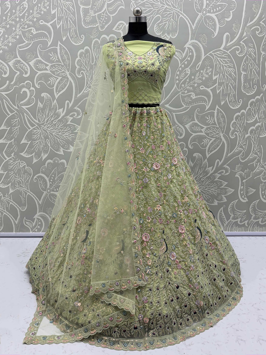 Exquisite Green Net Floral Embroidered Mehendi Wear Lehenga Choli