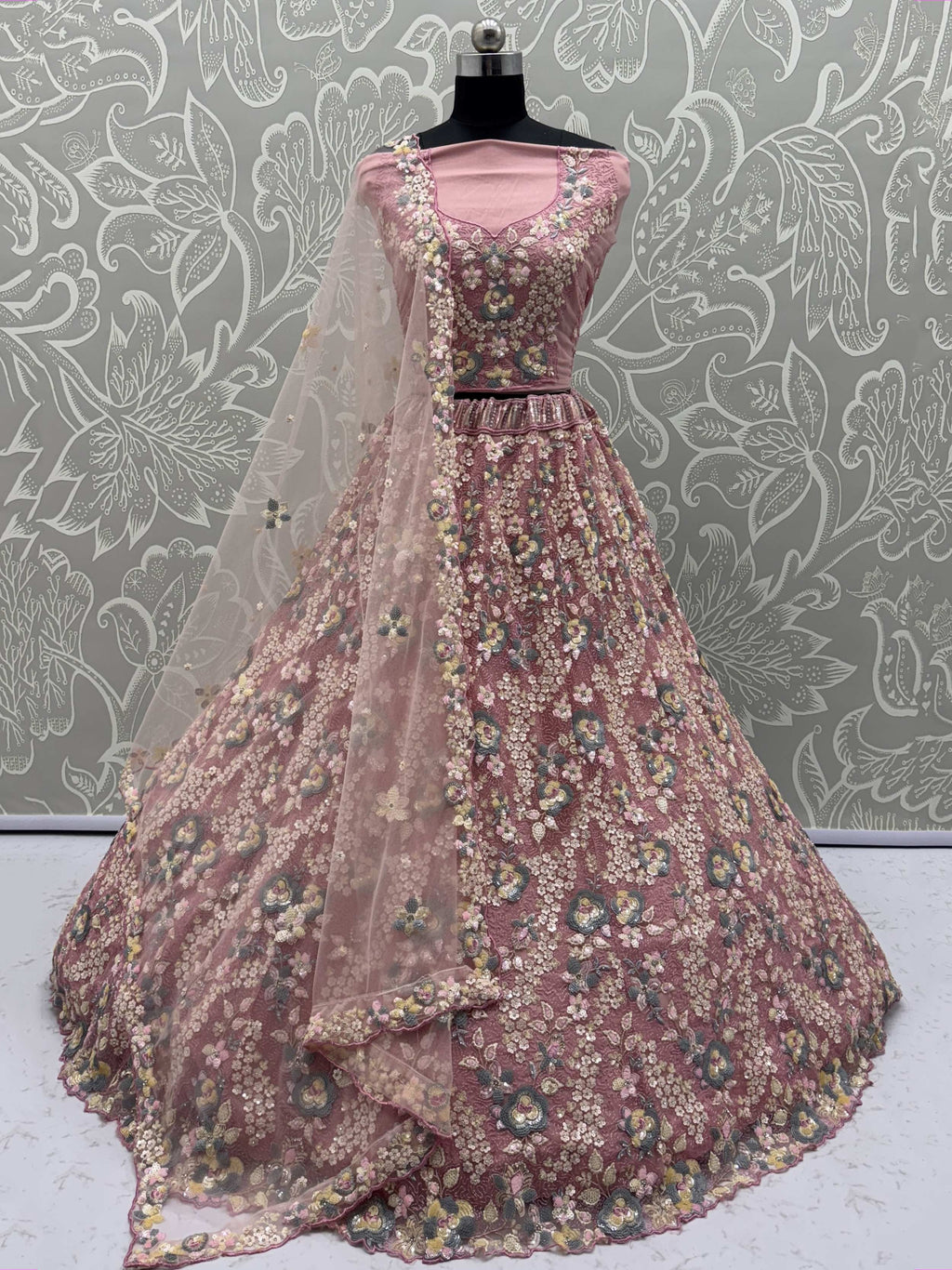 Tantalizing Pink Net Sequins Engagement Wear Lehenga Choli