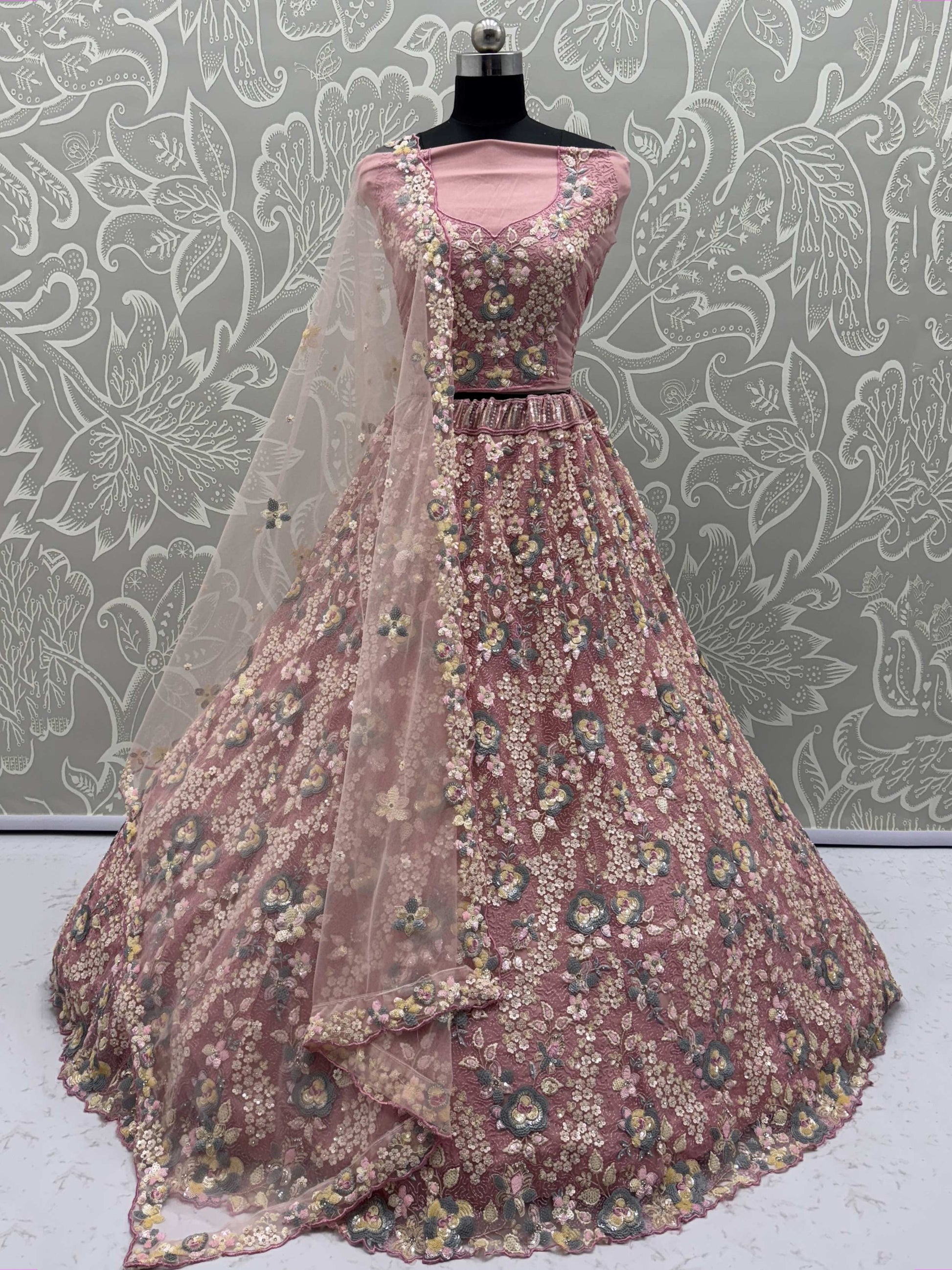 Tantalizing Pink Net Sequins Engagement Wear Lehenga Choli