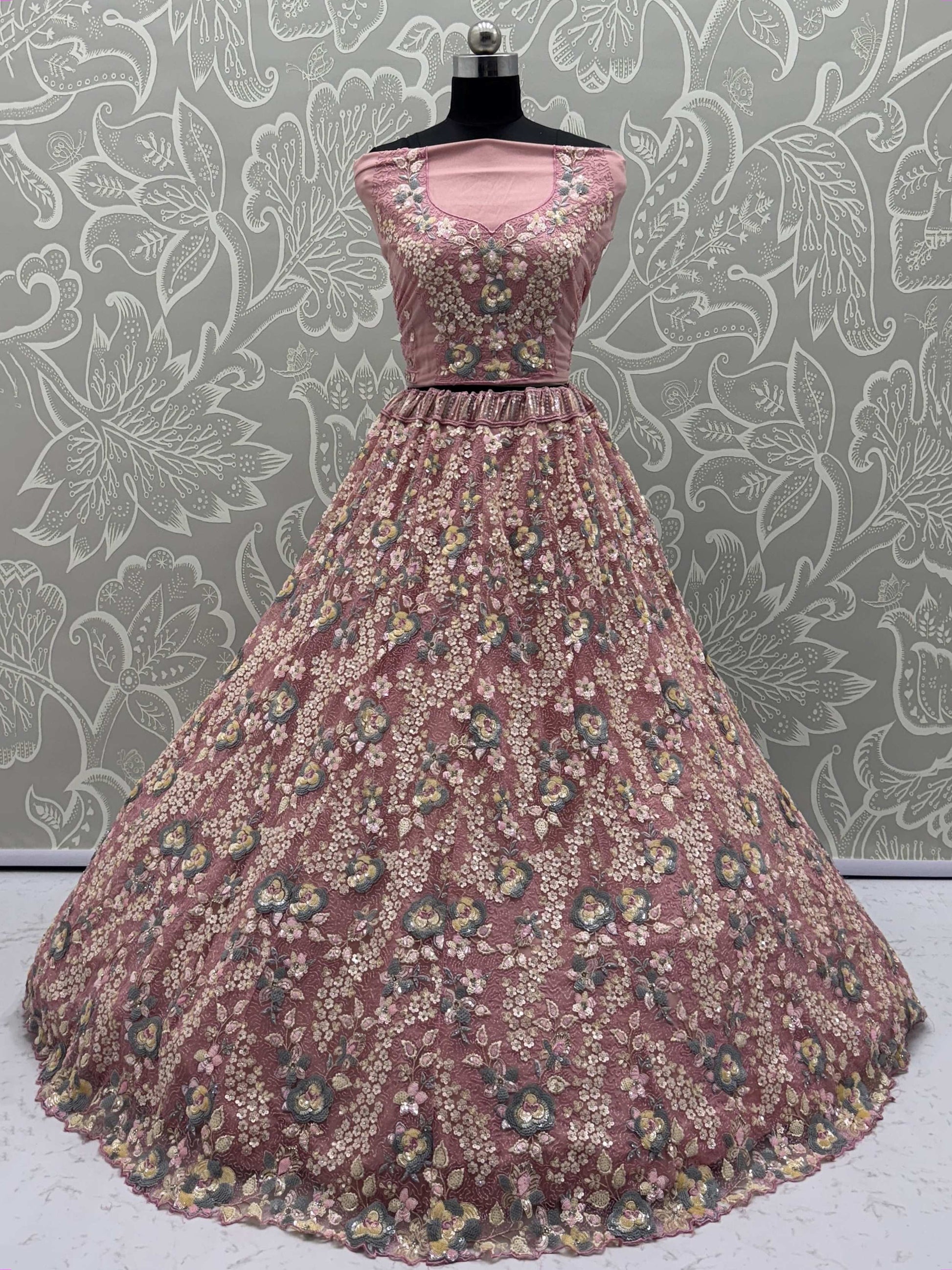 Tantalizing Pink Net Sequins Engagement Wear Lehenga Choli