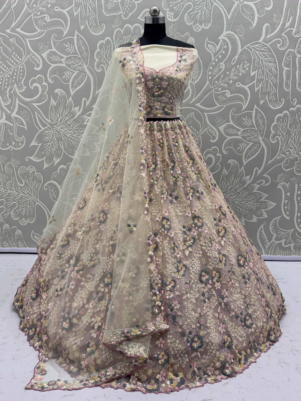 Bewitching Beige Net Embroidered Wedding Wear Lehenga Choli