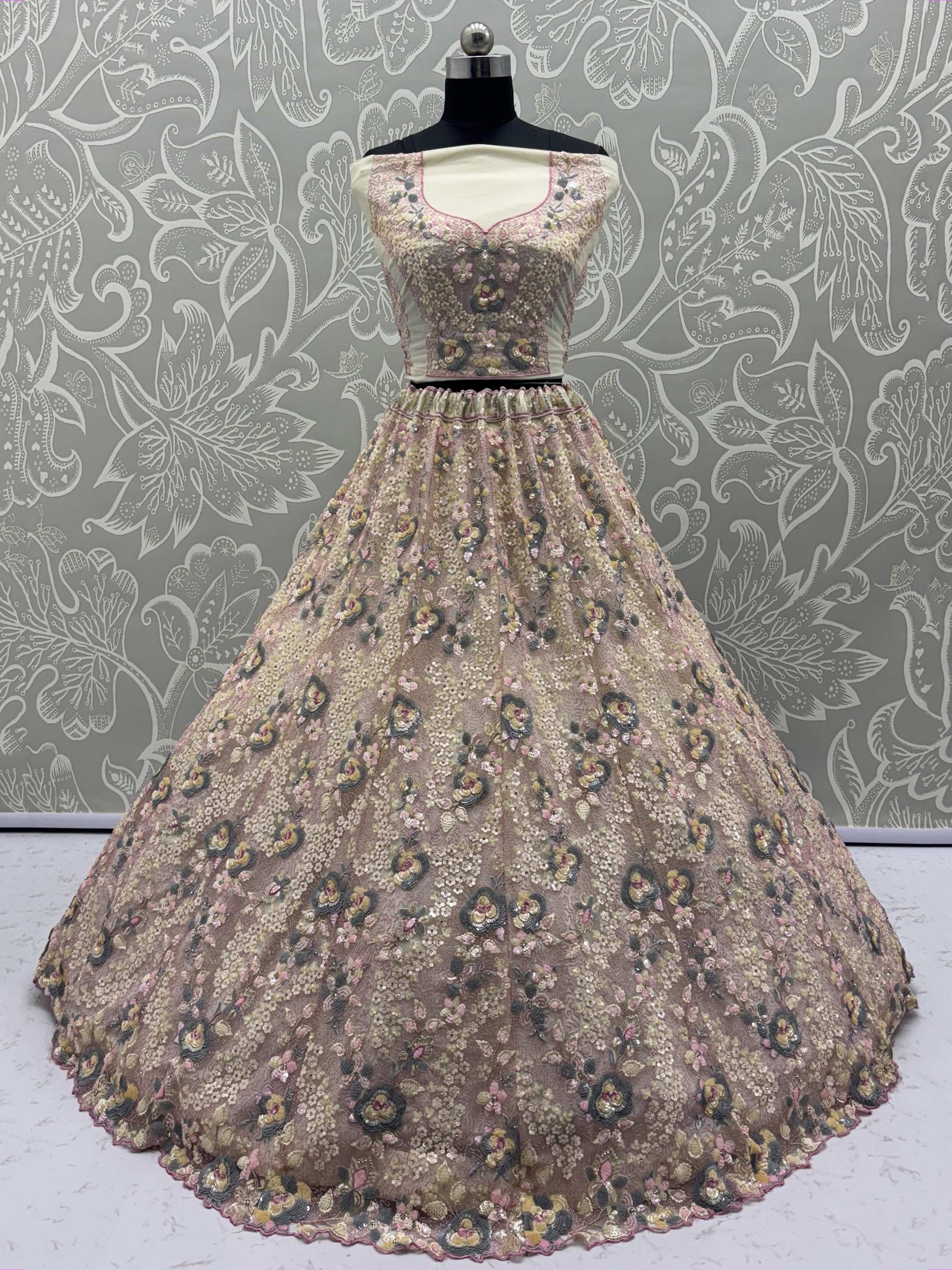 Bewitching Beige Net Embroidered Wedding Wear Lehenga Choli