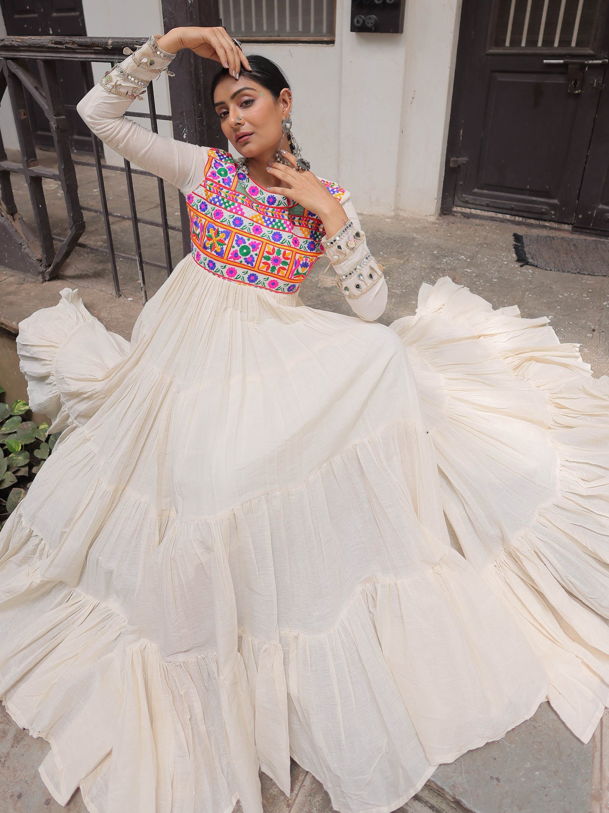 Alluring Off White Cotton Embroidered Navratri Special Gown