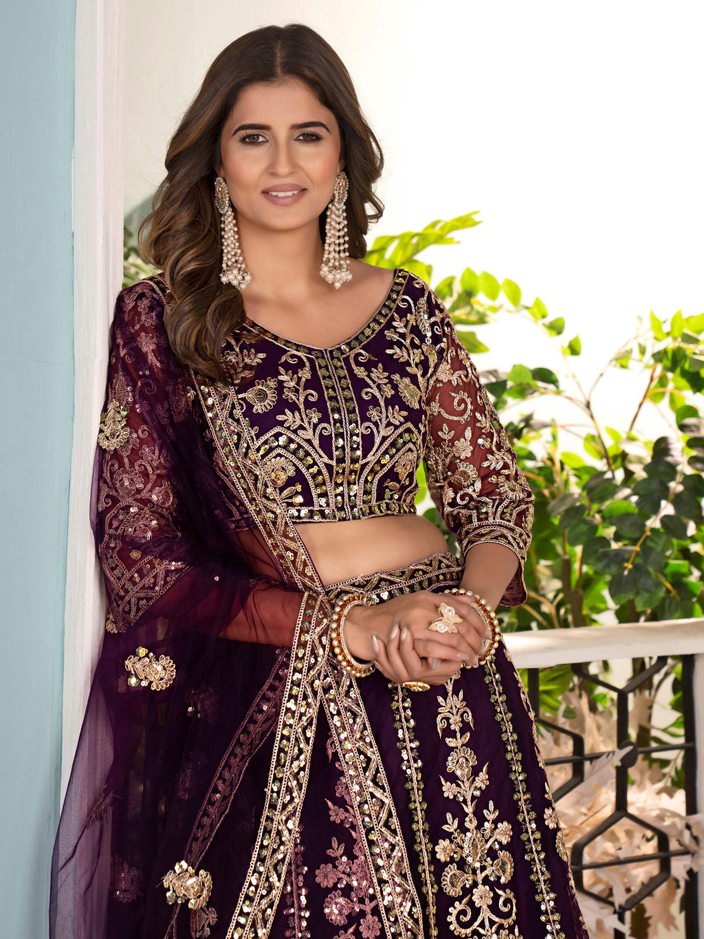 Captivating Wine Net Sequins Embroidered Bridesmaid Lehenga Choli