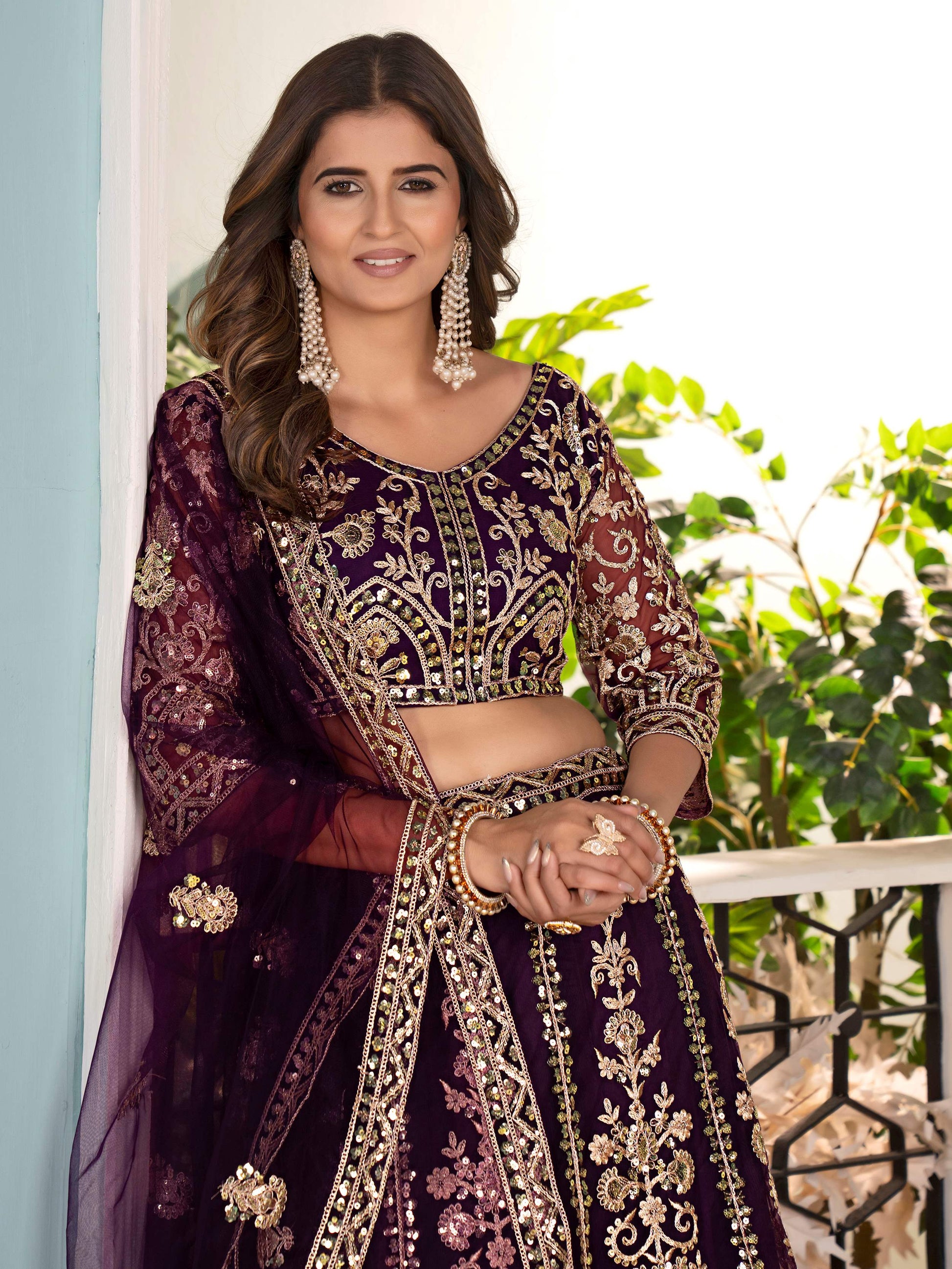 Captivating Wine Net Sequins Embroidered Bridesmaid Lehenga Choli