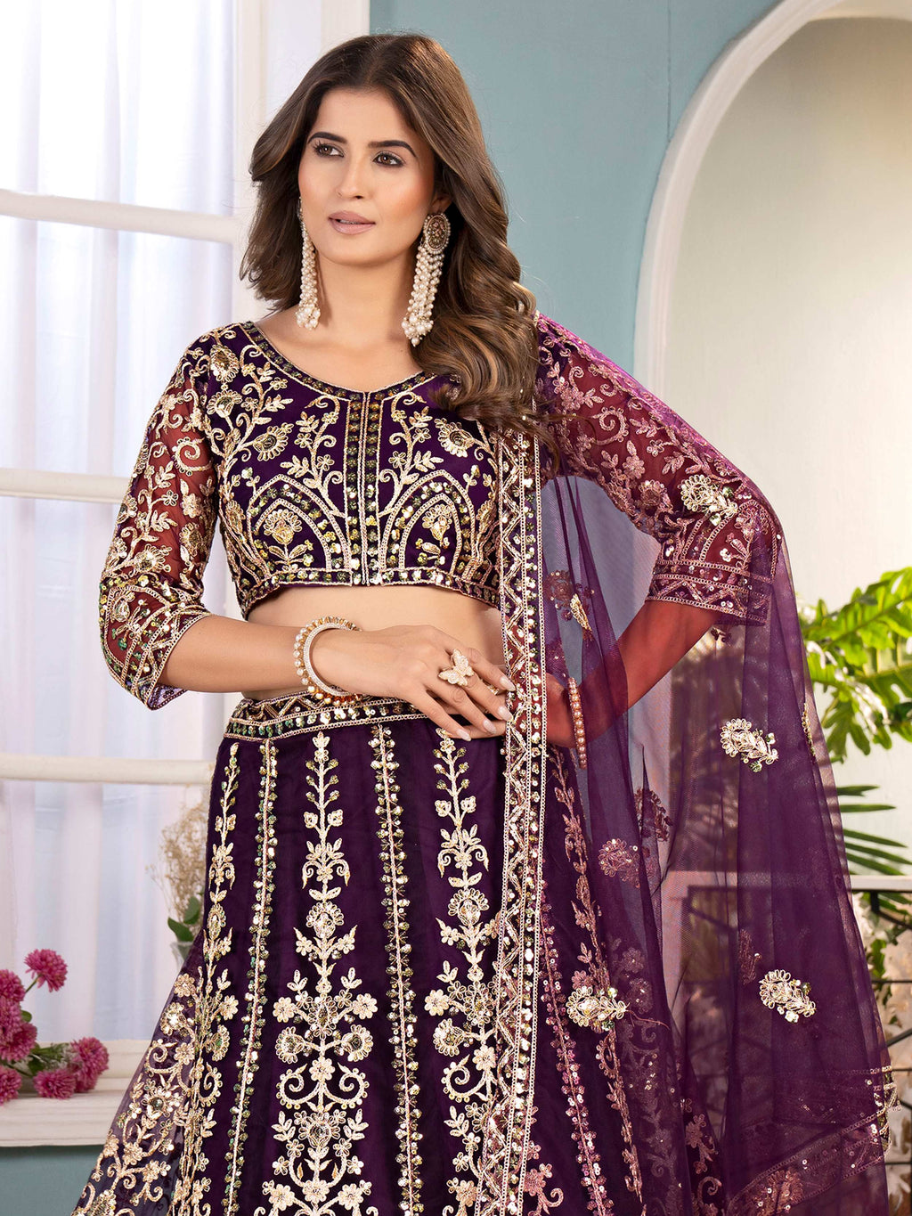 Captivating Wine Net Sequins Embroidered Bridesmaid Lehenga Choli